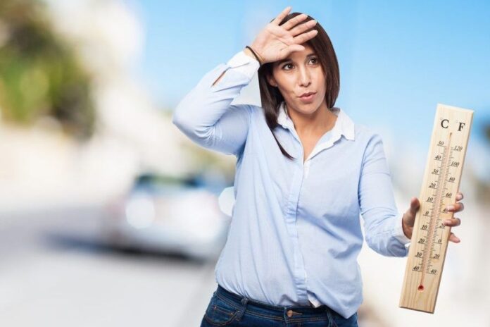Woman feeling hot during summer heat wave